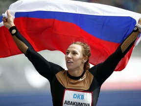 In this Sunday, Sept. 1, 2013 file photo, Russia's Maria Abakumova celebrates after winning the Women's Javelin Throw competition at the ISTAF Athletics Meeting in Berlin, Germany. (AP Photo/Michael Sohn, file)