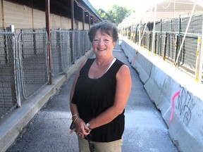 Yvonne Compton, the new president of the Kingston and District Agricultural Society, stands in one of the livestock areas on the fair grounds at the Memorial Centre in Kingston, Ont. on Tuesday, Sept. 13, 2016. The annual fall fair begins on Thursday. Michael Lea The Whig-Standard Postmedia Network