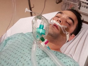 This is photo of Simon-Pierre Canuel, taken as he was in a coma in hospital after suffering a severe allergic reaction. Last May, a waiter at a Sherbrooke, Que. restaurant gave him salmon tartare instead of the beef he ordered, and now the waiter is under investigation for possible criminal negligence. (Supplied Photo)
