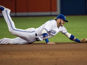 Blue Jays third baseman Josh Donaldson dives for the ball during a game against the Boston Red Sox at the Rogers Centre in Toronto Friday September 9, 2016. (Craig Robertson/Toronto Sun)