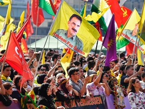 Thousands of Kurds, including many carrying flags with the image of jailed PKK leader Abdullah Ocalan, demonstrate in Cologne, Germany, Saturday, Sept. 3, 2016. Organizers say Saturday’s demonstration is aimed in part at protesting against Turkey’s military intervention in northern Syria and what they call the “dictatorial” behavior of Turkish President Recep Tayyip Erdogan. (AP Photo/Martin Meissner)