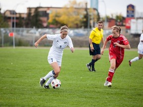 Second-year midfielder Marissa Webb eludes Augustana Vikings veteran Laura Graham during an opening-weekend shutout victory for the NAIT Ooks. Webb, an Archbishop O’Leary high school star, collected one of her team’s four goals. Striker Kassy Jajczay lived up to the high-scoring reputation she established a year ago by collecting all the other tallies. (Courtesy NAIT Athletics)