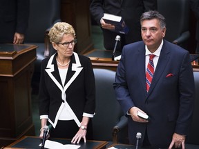 Premier Kathleen Wynne and Finance Minister Charles Sousa at Queen's Park. (The Canadian Press)