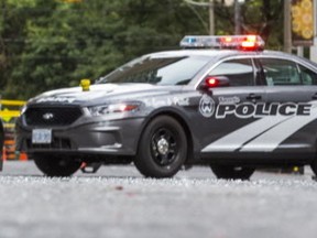 Shattered glass, which fell from a building on Simcoe St. between Adelaide St. and Richmond St. on Sept. 14, 2016. (Ernest Doroszuk/Toronto Sun)