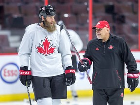 Joe Thornton talks with coach Barry Trotz as Team Canada practicesn preparation for the World Cup of Hockey Tournament.