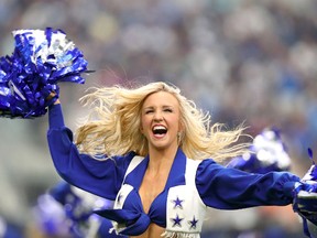 Dallas Cowboys cheerleaders perform on the field during the game against the New York Giants at AT&T Stadium on September 11, 2016 in Arlington, Texas. (Tom Pennington/Getty Images)