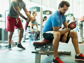 Unilateral upper-body exercises include biceps curls. (Getty Images)