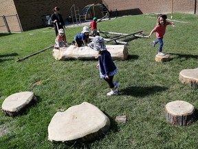 Emily Mountney-Lessard/The Intelligencer
Children utilize some of the nature-inspired playground components at the Belleville YMCA on Wednesday. The local YMCA is one of 18 local childcare centres that received the equipment from The Healthy Kids Community Challenge Hastings Prince Edward.