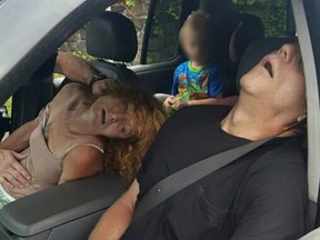 In this Wednesday, Sept. 7, 2016, file photo, released by the East Liverpool Police Department, a young child sits in a vehicle behind his grandmother, Rhonda Pasek and her boyfriend, James Acord, both of whom are unconscious from a drug overdose, in East Liverpool, Ohio. An Ohio judge has turned over the custody of the boy. A Columbiana County Juvenile Court administrator told The Associated Press that the boy's great uncle and great aunt petitioned the court for custody, which was granted by a judge on Monday, Sept. 12. (East Liverpool Police Department via AP, File)