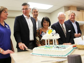 Rapids Family Health Team in Sarnia celebrated its 10th anniversary Wednesday. Pictured at the cake cutting are (from left): Lynn Laidler, executive director, Wayne Carpani, board chair, Bluewater Health's Mike Lapaine, Lambton County Warden Bev MacDougall, Jim Houston with the Lambton Seniors Association, and the Erie St. Clair LHIN's Ralph Ganter. (Tyler Kula/Sarnia Observer/Postmedia Network)