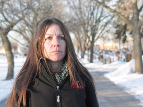 Denise Stark, mother of Cpl. Justin Stark, is seen at the cemetery where her son is buried in Hamilton, Ont., on Thursday, March 6, 2014. The mother of a Canadian soldier who killed himself after serving in Afghanistan will finally be honoured with a Memorial Cross this weekend, ending a long battle to have the military recognize his death as service related. THE CANADIAN PRESS/Colin Perkel