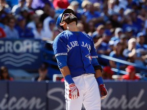 Toronto Blue Jays slugger Jose Bautista reacts after striking out against the Tampa Bay Rays at the Rogers Centre in Toronto on Wednesday, Sept.14, 2016. (STAN BEHAL/Toronto Sun)