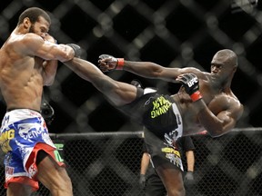 Uriah Hall kicks Thiago Santos during their middleweight mixed martial arts bout at UFC 175 on Saturday, July 5, 2014, in Las Vegas. (AP Photo/John Locher)