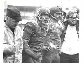From left, assistant coach Walt Garrett, players Joe Veryard and Brent Cantelon and assistant coach Rob Williams on the sideline during a senior football game against the Loyalist Lancers in 1976. (Supplied photo)