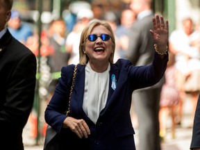 In this Sept. 11, 2016 file photo, Democratic presidential candidate Hillary Clinton waves after leaving an apartment building in New York. Hillary Clinton's doctor says she is recovering from her pneumonia and remains "healthy and fit to serve as President of the United States." The statement was part of medical information Clinton's campaign released Wednesday, Sept. 14, 2016, after her pneumonia diagnosis last week. (AP Photo/Andrew Harnik, File)