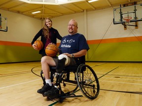 Luke Hendry/The Intelligencer
Trenton's Gus Sacrey joins Belleville's Katherine Kerr in the Belleville YMCA gym in Belleville Wednesday. Kerr and Belleville's Kristen Whalen have organized an event Saturday at the Quinte West YMCA to allow people of all abilities to try adaptive sports. Sacrey said participating in such sports lifted him from depression after a partial leg amputation.