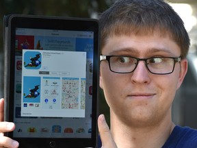 Troy Pavlek, software developer, showing the citys newly launched Smart Travel App which he says it's not that good, in Edmonton Wednesday, September 14, 2016. Ed Kaiser/Postmedia