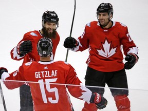 Team Canada's Ryan Getzlaf (15) celebrates his overtime goal against Russia with Brent Burns (88) and John Tavares (20) in a World Cup of Hockey exhibition game in Pittsburgh on Wednesday, Sept. 14, 2016. (Gene J. Puskar/AP Photo)
