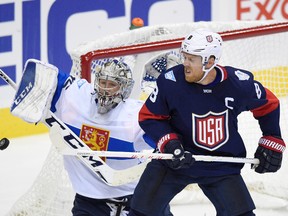 U.S. forward Joe Pavelski (right) works for the puck against Finland goalie Pekka Rinne during an exhibition game prior to the World Cup of Hockey in Washington on Tuesday, Sept. 13, 2016. (Nick Wass/AP Photo)