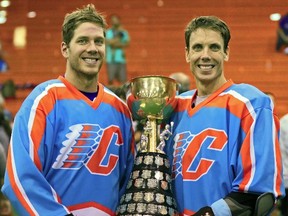 Paul Dawson (left) and Dan Dawson (right) of the Six Nations Chiefs celebrate their win Wednesday night.  The Six Nations Chiefs won game five 14-6 against the Maple Ridge Burrards to take the Mann Cup national lacrosse championship. (Ray Chan/Special to The Expositor)