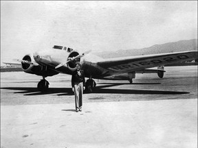 Undated picture taken in the 30's of American female aviator Amelia Earhart in front of her plane. (STAFF/AFP/Getty Images)