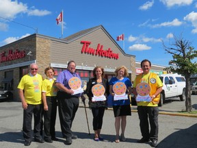 Tim Hortons owners Gary and Marian Mackenzie, left, Dan Xilon, of the Sudbury Food Bank, Yolanda Thibeault, of the Vale Hospice, Debra Dawe, of Health Sciences North Foundation, and Sam Khoury, of the CTV Lions Telethon, helped to launch the Smile Cookie campaign in Greater Sudbury. Supplied photo