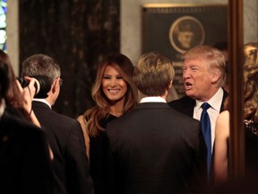 Republican presidential candidate Donald Trump and his wife Melania meet with family members of Phyllis Schlafly before the start of a funeral Mass for Schlafly, Saturday, Sept. 10, 2016, in St. Louis. Schlafly, the outspoken conservative activist who helped defeat the Equal Rights Amendment in the 1970s and founded the Eagle Forum political group, died Monday at the age of 92. (Robert Cohen/St. Louis Post-Dispatch via AP, Pool)