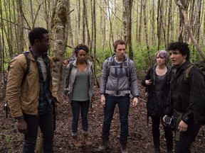 Actors Brandon Scott, left to right, Corbin Reid, James Allen McCune, Valorie Curry and Wes Robinson stand during a scene from the film "Blair Witch."