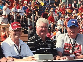 From left, Bubs Van Hooser, Len Coyle and Wayne Burns, long-serving timekeepers at Queen’s Golden Gaels football games. The three have been relieved of their duties by the university. (Supplied photo)