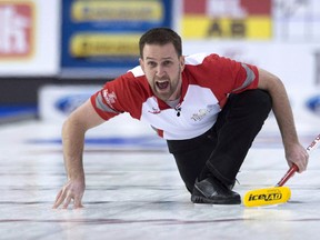 Skip Brad Gushue reacts as his shot enters the house during the gold medal game at the Brier Sunday March 13, 2016 in Ottawa. (THE CANADIAN PRESS/Adrian Wyld)