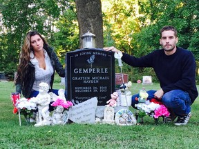 Alisha Tackaberry and Marc Gemperle at the grave of their son, Graysen, west of Brockville. It was recently desecrated.