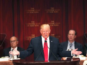 Republican presidential candidate Donald Trump speaks at a lunch hosted by the Economic Club of New York on September 15, 2016 in New York City. According to a report by Oxford Economics, if Trump is elected to the White House growth in the US would be about 5 per cent lower than would otherwise be expected by 2021. (Photo by Spencer Platt/Getty Images,)