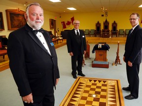 Luke Hendry/The Intelligencer
Masons John Bonnin, left, Jack Rushnell and Dan Boyle stand in the lodge room of the Quinte Masonic Centre in Frankford Thursday. Masons opened the centre Thursday evening for a public banquet and ceremony marking the amalgamation of Frankford's Franck Lodge and the Stirling Lodge into the new Quinte Lodge.
