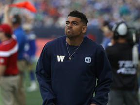 Injured Winnipeg Blue Bombers RB Andrew Harris reacts on the sideline during CFL action against the Saskatchewan Roughriders ing the Banjo Bowl in Winnipeg on Sat., Sept. 10, 2016. Kevin King/Winnipeg Sun/Postmedia Network