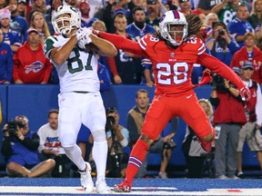 Jets wide receiver Eric Decker (left) catches a touchdown pass next to Bills cornerback Ronald Darby (right) during first half NFL action in Orchard Park, N.Y., on Thursday, Sept. 15, 2016. (Bill Wippert/AP Photo)