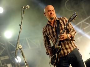 In this April 12, 2014 file photo, Joey Santiago of The Pixies performs at the 2014 Coachella Music and Arts Festival in Indio, Calif.. (Photo by Chris Pizzello/Invision/AP)