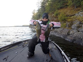 Frank Clark's wife Jakie shows a pair of big fall smallmouth bass. Fall is the time the trophies group up, so keep that boat in the water, Clark writes. Frank Clark/For The Sudbury Star