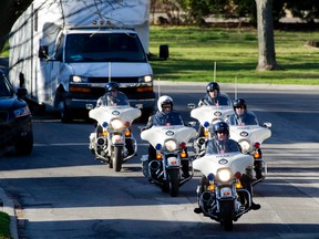 Motorcycle cops in a motorcade in 2012. (Aaron Lynett/Postmedia file photo)