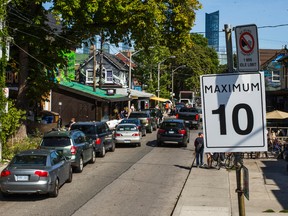 A fake sign in Kensington Market advertises the speed limit as 10 km/h. (ERNEST DOROSZUK, Toronto Sun)