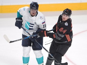 Team Europe's Anze Kopitar is checked by Team North America's Auston Matthews during pre-tournament World Cup of Hockey action on Sept. 11, 2016 in Montreal. (THE CANADIAN PRESS/Ryan Remiorz)