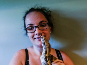 Alyson Smith holds her two-year-old boa constrictor, Little Girl. (DAVE THOMAS, Toronto Sun)