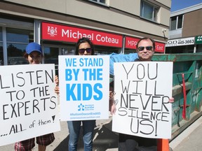 Ontario Autism Coalition demonstrators gather outside Liberal minister Michael Coteau’s constituency office on Friday Sept. 16, 2016. (Veronica Henri/Toronto Sun)