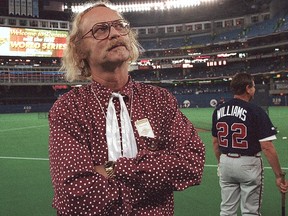 Canadian author W.P. Kinsella stands on the baseball field before game five of the World Series between Toronto Blue Jays and Atlanta Braves at the Skydome in Toronto, Ontario, Thursday, Oct. 23, 1992. W.P. Kinsella, the B.C.-based author of "Shoeless Joe," the award-winning novel that became the film "Field of Dreams," has died at 81. THE CANADIAN PRESS/AP, Rusty Kennedy