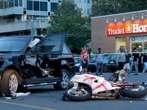 A white motorcycle and a Range Rover after a collision on George Street Friday. TONY CALDWELL / POSTMEDIA NETWORK