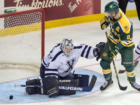 University of Alberta Golden Bears' Brett Ferguson, right, is stopped by St. Francis Xavier X-Men's goalie Drew Owsley during first period CIS championship hockey action in Halifax on Thursday, March 17, 2016. The Golden Bears recruited an impressive class for the 2016-2017 season.