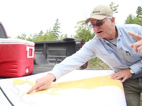 Gino Donato/Sudbury Star
William Stone, principal consulting geologist with Pacific North West Capital Corp., shows a map at the company's River Valley PGM deposit in River Valley.