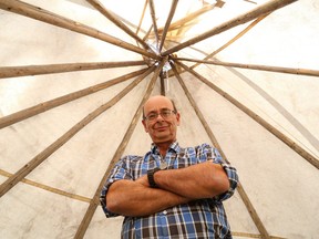 John Lappa/Sudbury Star
Metis Rick Meilleur stands inside a teepee that is part of Rendezvous Village at the Cafe-Heritage Festival at Whitewater Lake Park in Azilda on Friday. The festival runs until Sunday and features music, children's activities, vintage engines and Riel, an outdoor theatrical and musical production starting at 6:30 p.m. on Saturday.