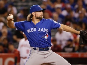 Toronto Blue Jays starting pitcher R.A. Dickey throws against the Los Angeles Angels during the first inning of a baseball game in Anaheim, Calif., Friday, Sept. 16, 2016. (AP Photo/Chris Carlson)