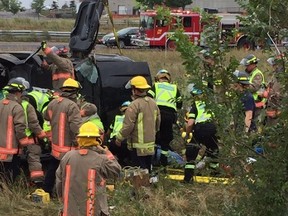 Paramedics and firefighters at the scene of a fatal Hwy. 401 rollover on Saturday, Sept. 17, 2016 (Photo tweeted by Peel Paramedics)