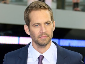 FILE - In this May 7, 2013, file photo, actor Paul Walker arrives for the World Premiere of "Fast & Furious 6," in central London. Walker's brother, Caleb, told "Entertainment Tonight" in a story published online on Sept. 15, 2016, that he has had a discussion with franchise co-star Vin Diesel about and when they may be able to bring Paul Walker’s character, Brian O’Conner, back for a cameo. Paul Walker died in a November 2013 car accident.